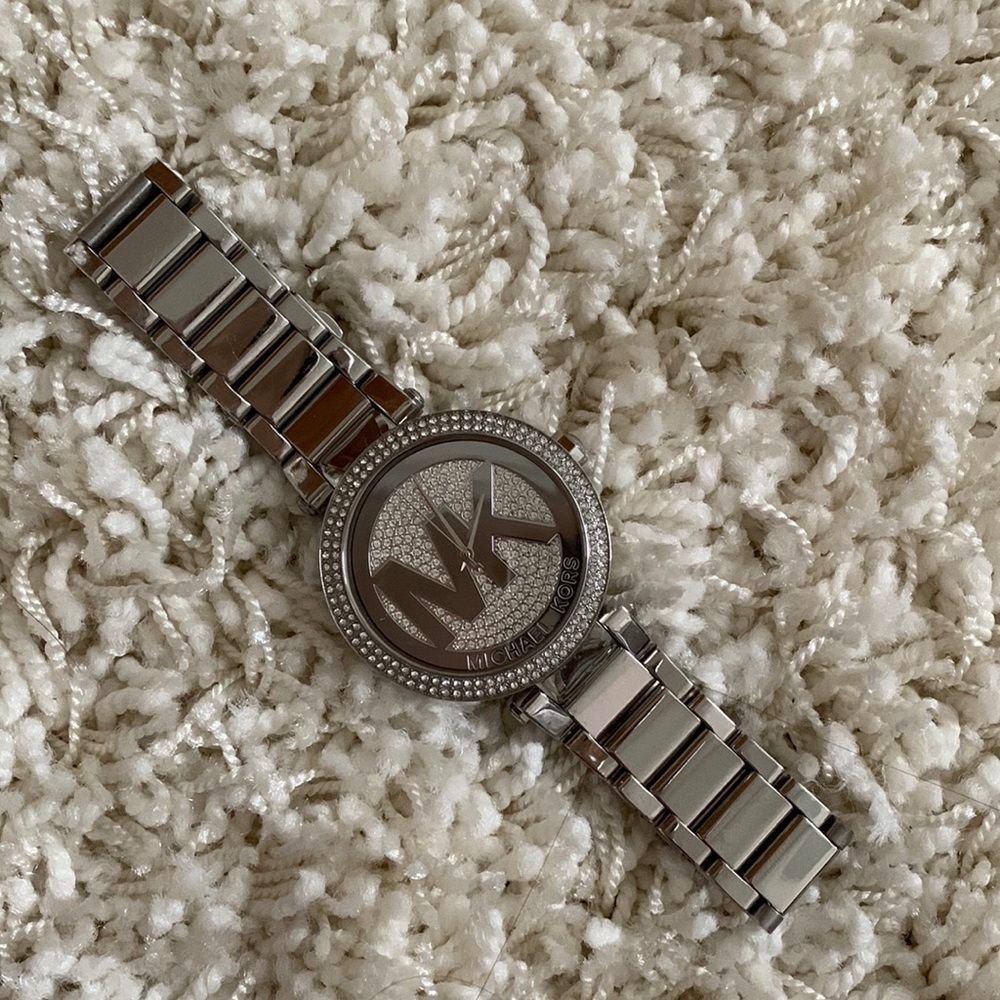 Michael Kors silver watch. Has crystals around the edge.
